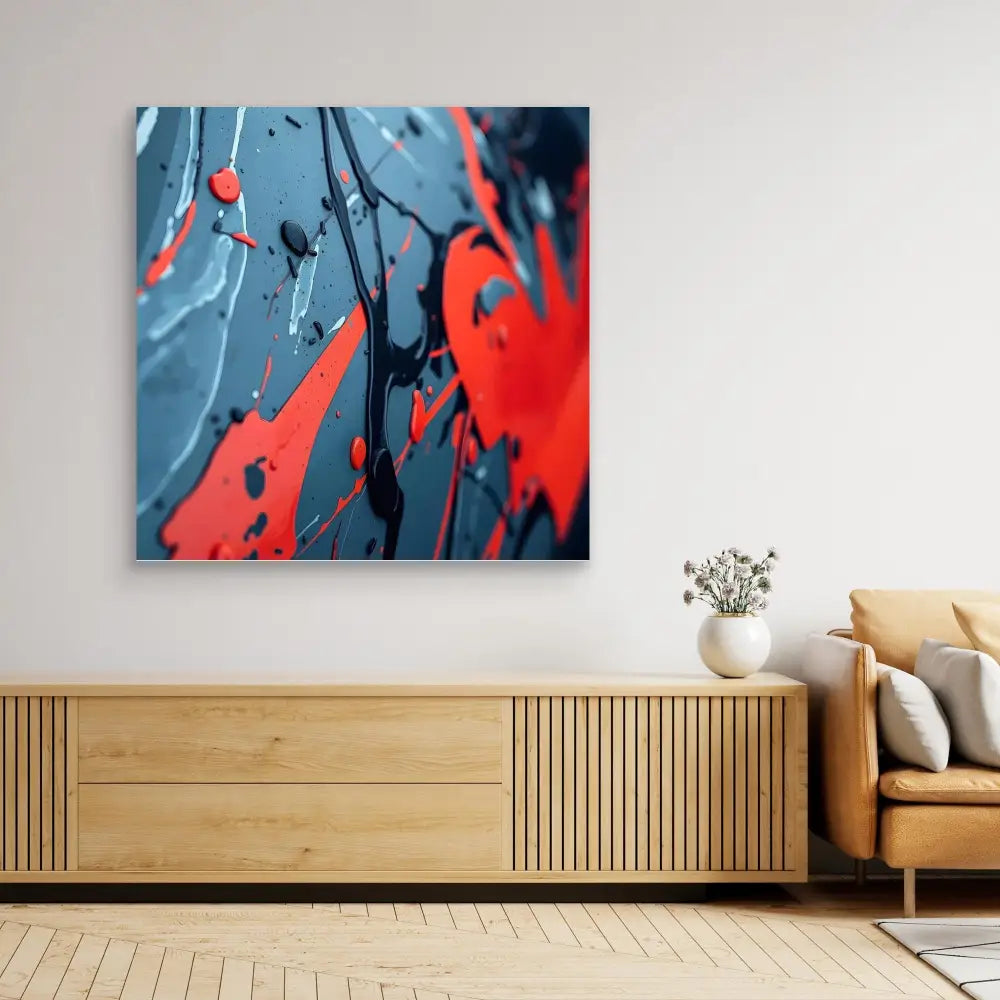 Abstract artwork featuring dramatic red paint splatters against a blue background.