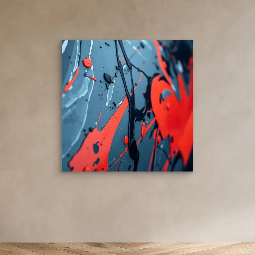 Abstract artwork featuring splattered red and blue paint patterns.