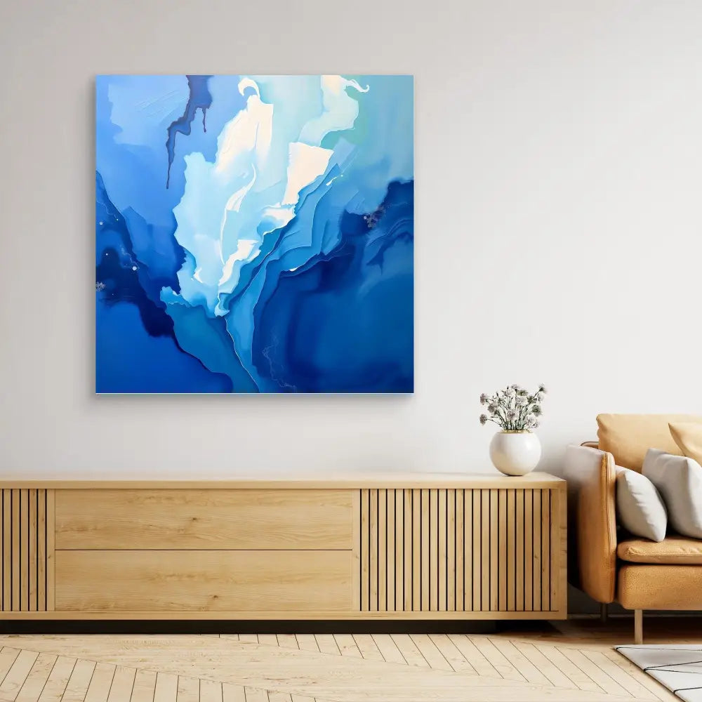 Abstract blue and white fluid art painting with swirling watercolor-like patterns.