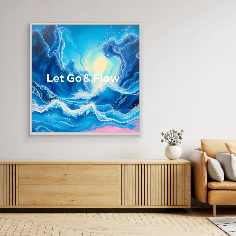 Abstract blue and white fluid art painting with text ’Let Go & Flow’ displayed on a canvas.