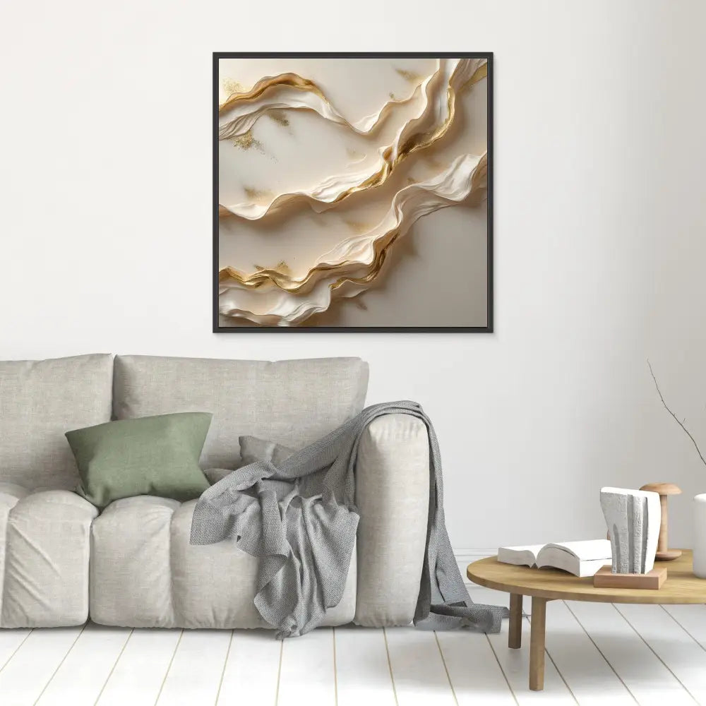 Abstract wall art featuring flowing golden waves against a cream-colored background.