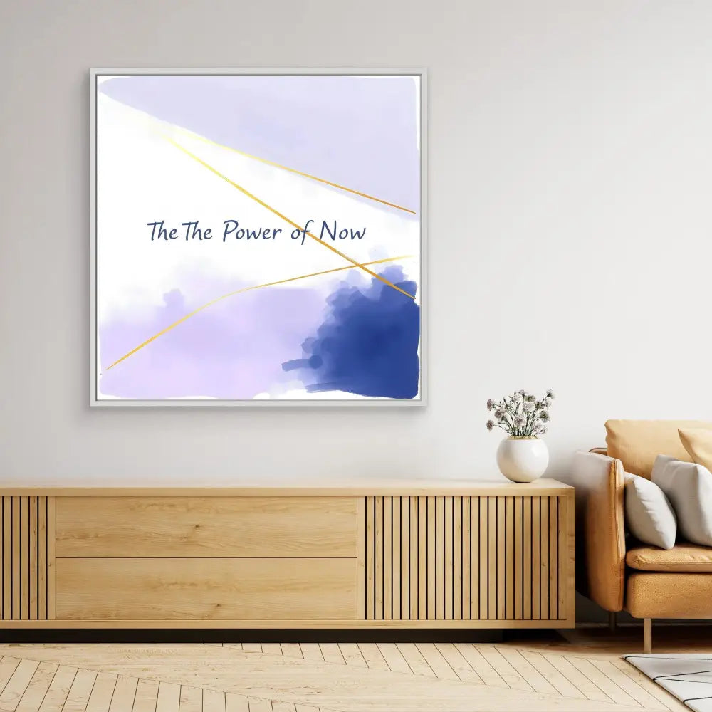 Abstract wall art featuring purple watercolor and gold accents with text reading ’The Power of Now’