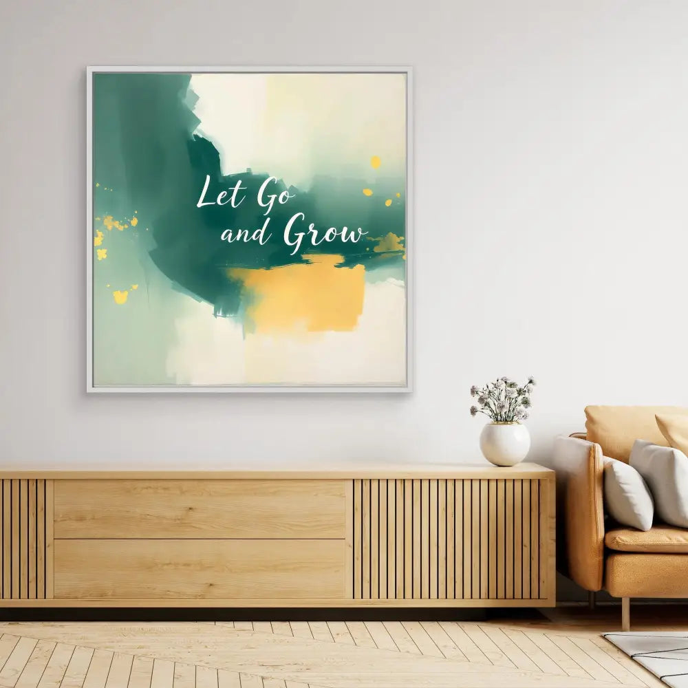 Abstract wall art featuring watercolor splashes in green and yellow with the text ’Let Go and Grow’