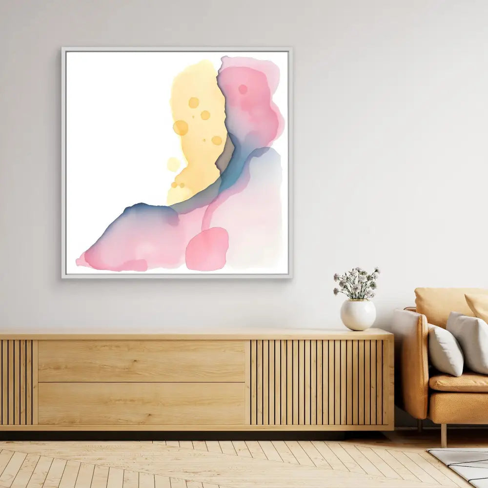 Abstract watercolor artwork featuring soft yellow, pink and blue flowing shapes.