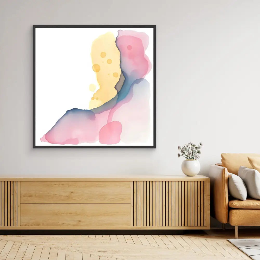 Abstract watercolor painting featuring soft yellow, pink and blue flowing shapes in a black frame.