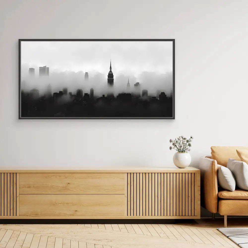 Black and white cityscape photograph showing a misty New York skyline with the Empire State Building silhouetted against a foggy backdrop.