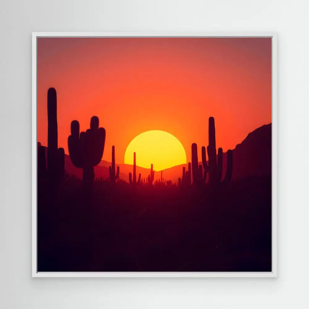 Bright orange sun setting behind silhouetted saguaro cacti.