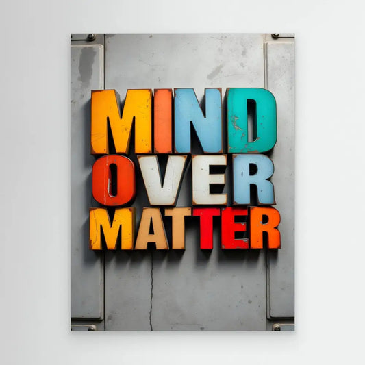 Colorful 3D text spelling ’MIND OVER MATTER’ mounted on a surface.