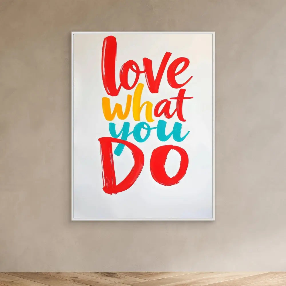 A colorful motivational wall art featuring the text ’love what you do’ in red, yellow, and turquoise brush lettering.