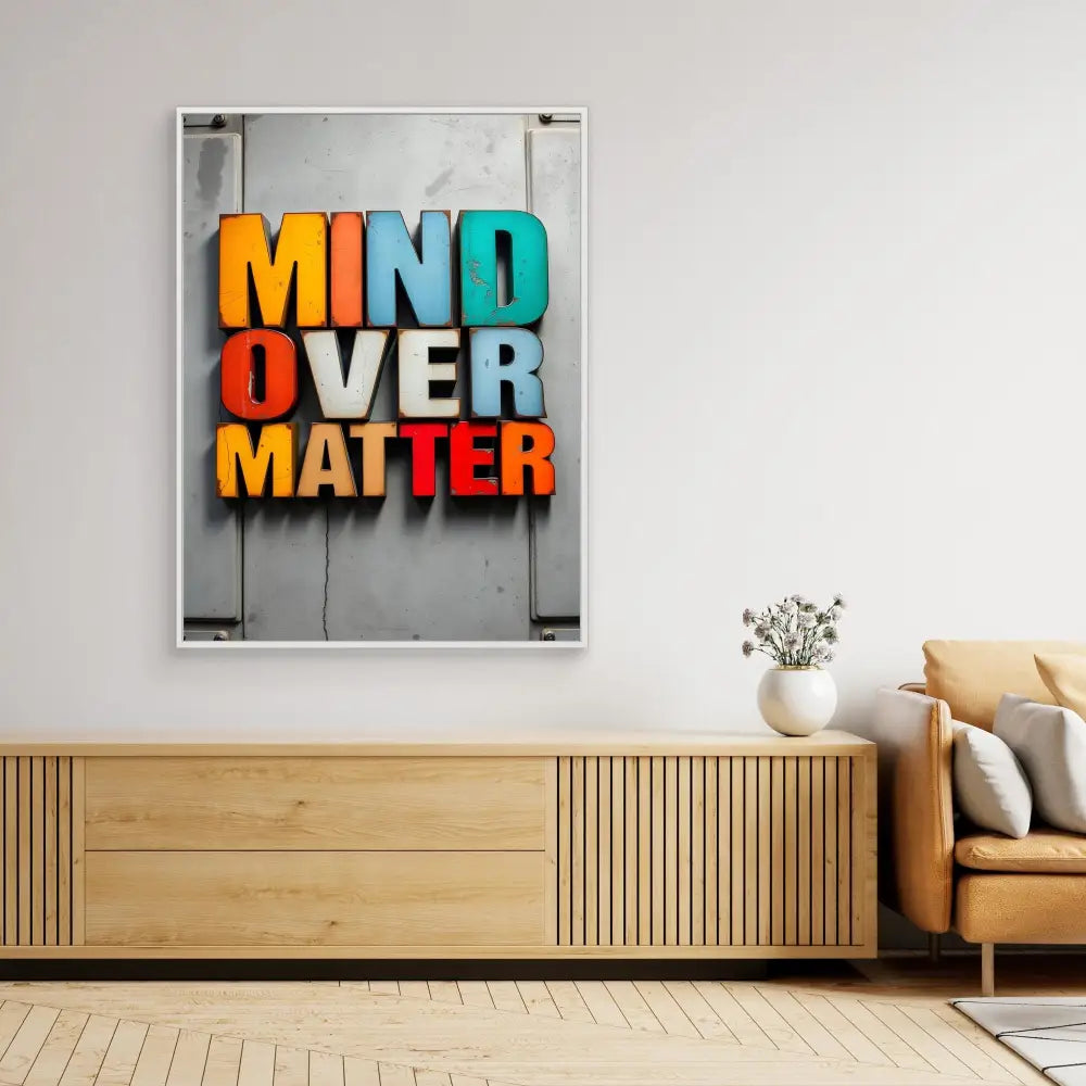 Colorful wall art displaying the text ’MIND OVER MATTER’ in bold letters.