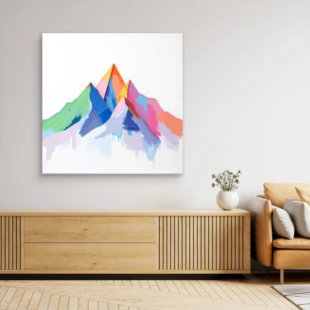 Colorful watercolor mountain painting with overlapping geometric peaks in pink, blue, orange and green hues.