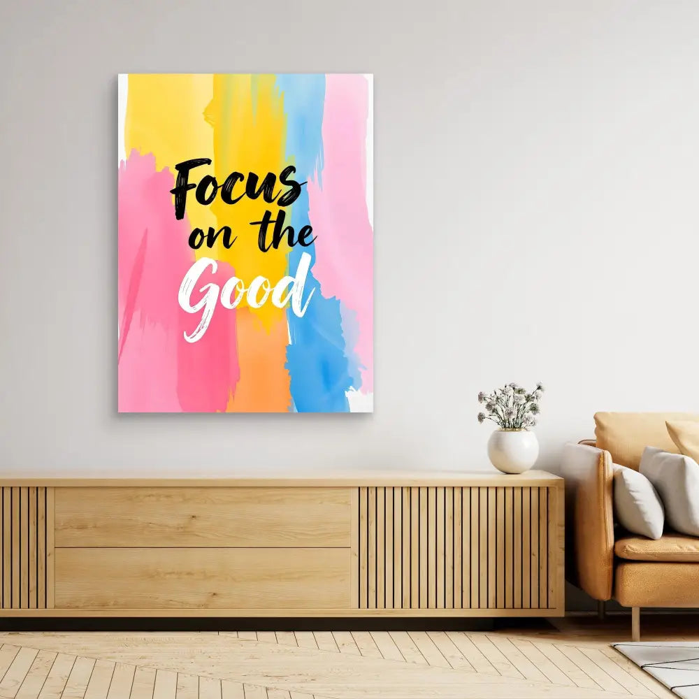 Colorful watercolor wall art with black text reading ’Focus on the Good’