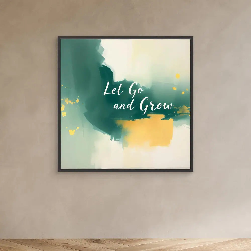 Framed abstract wall art featuring emerald green and golden watercolor splashes with white text reading ’Let Go and Grow’