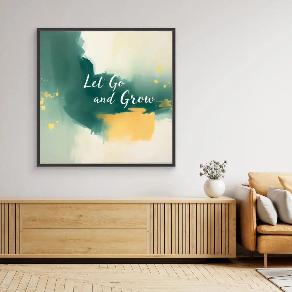 Framed abstract wall art featuring watercolor splashes in green and yellow with the text ’Let Go and Grow’