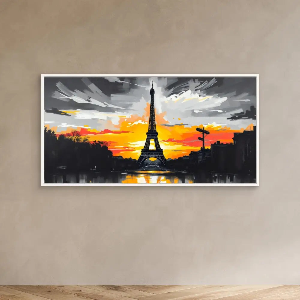 Framed artwork depicting the Eiffel Tower silhouetted against a dramatic orange sunset.