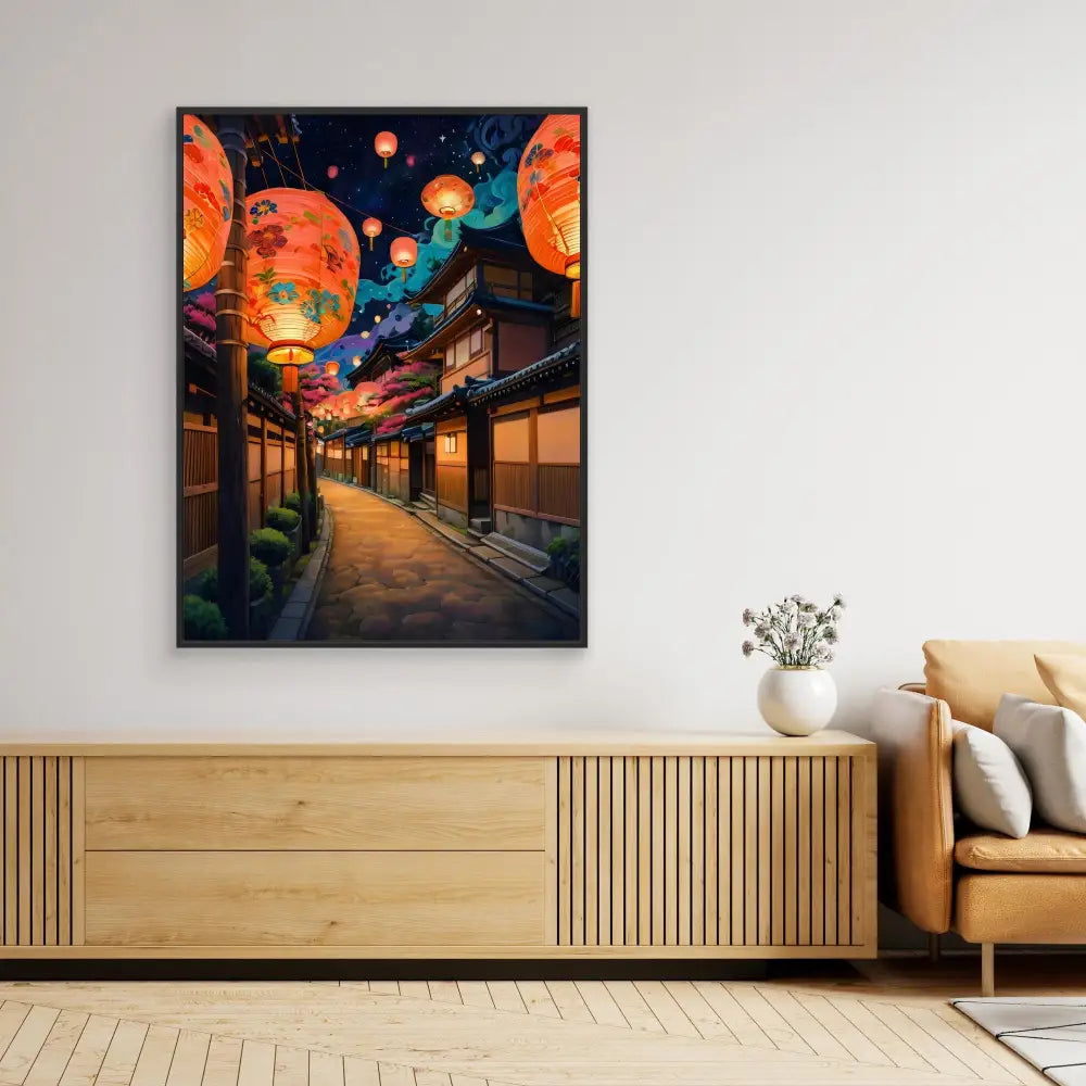 Framed artwork depicting a Japanese street at night with glowing orange lanterns and a colorful sky.