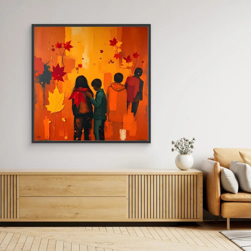 Framed artwork depicting silhouetted figures against a vibrant orange background with falling red maple leaves.