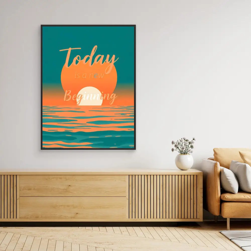 Framed artwork featuring a sunset or sunrise over water in teal and orange colors.