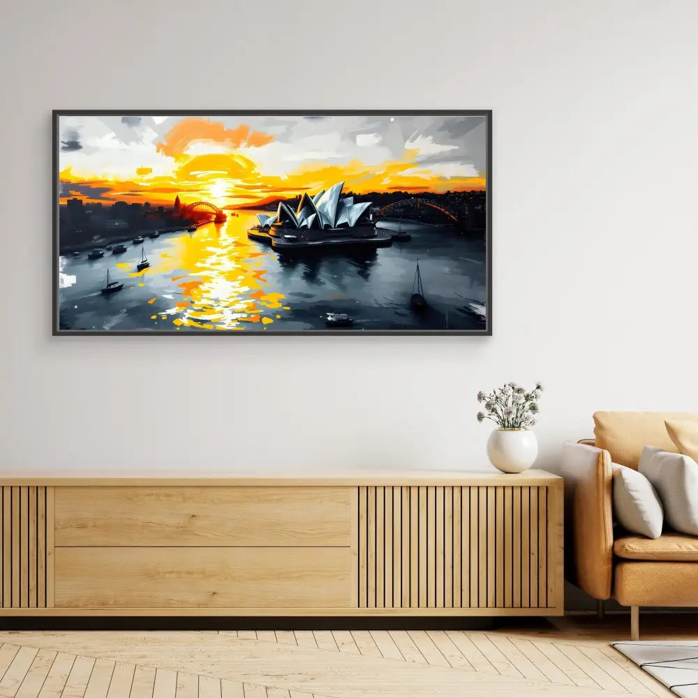 A framed artwork depicting Sydney Opera House at sunset with orange and yellow reflections on the harbor.