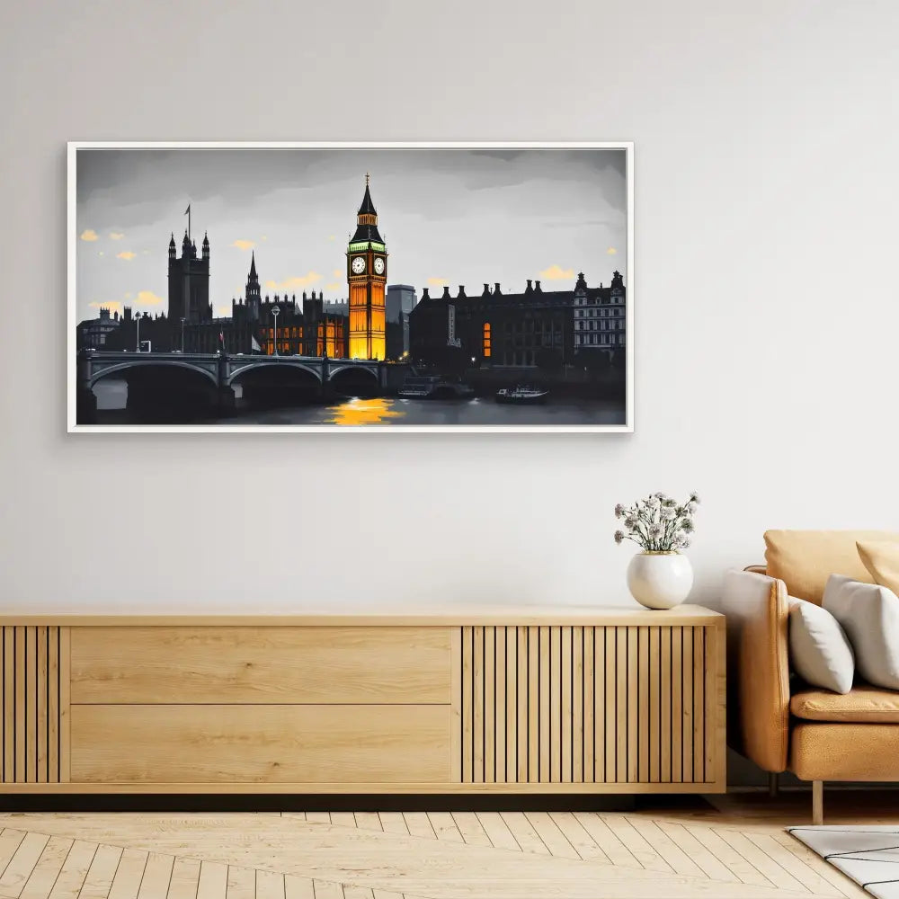 A framed black-and-white photograph of London’s Houses of Parliament and Big Ben at night with selective yellow illumination.