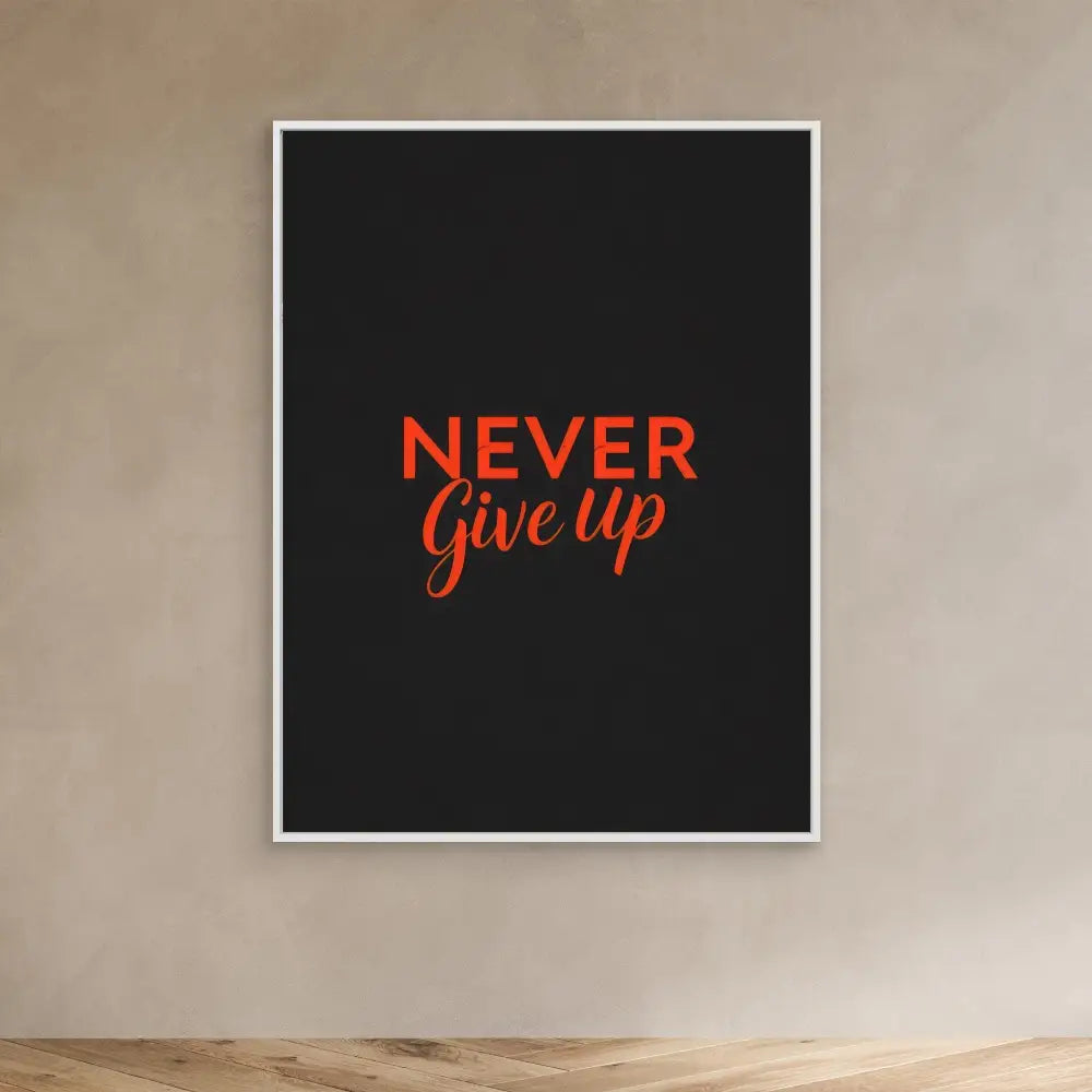 A framed black poster with ’NEVER GIVE UP’ written in red text.