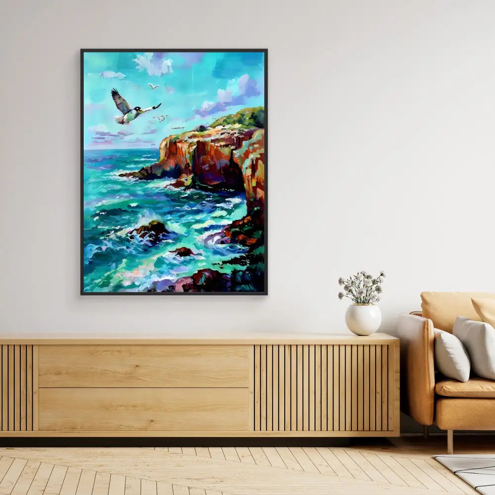 Framed coastal seascape painting featuring rocky cliffs, turquoise waters, and a soaring bird.