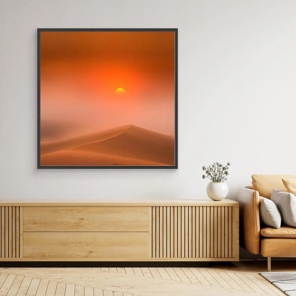 Framed desert landscape artwork featuring sand dunes beneath an orange sunset.