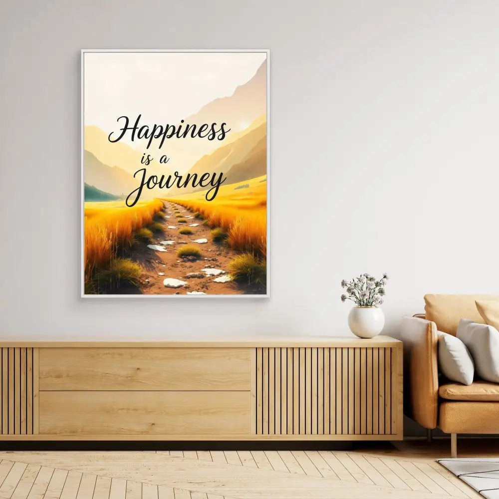 Framed inspirational artwork featuring the text ’Happiness is a Journey’ over a painted landscape path through golden fields.