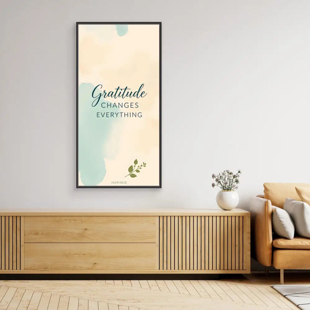 Framed inspirational wall art featuring the text ’Gratitude changes everything’ on a soft mint and cream background.