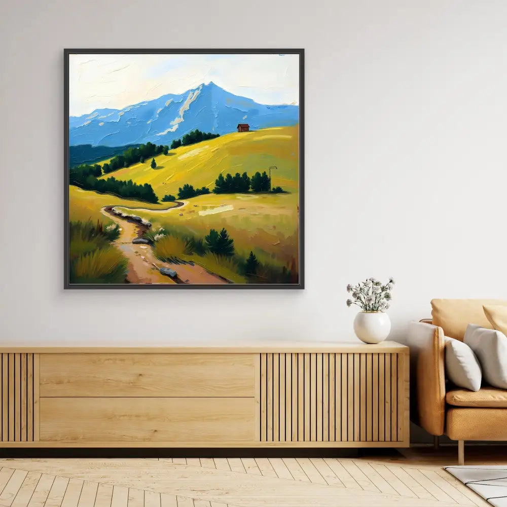 Framed landscape painting featuring golden hills, a winding path, and a snow-capped mountain.