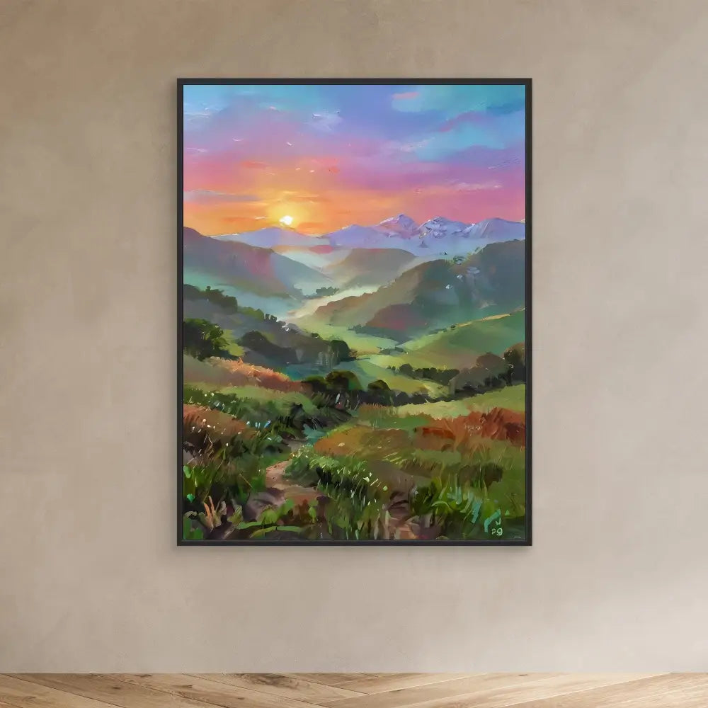 A framed landscape painting depicting mountains and valleys at sunset with colorful skies.