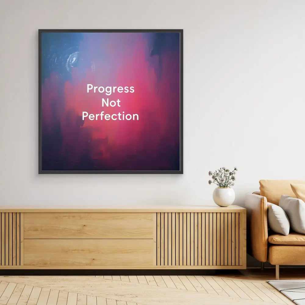 Framed motivational artwork displaying ’Progress Not Perfection’ text on a pink and purple gradient background.