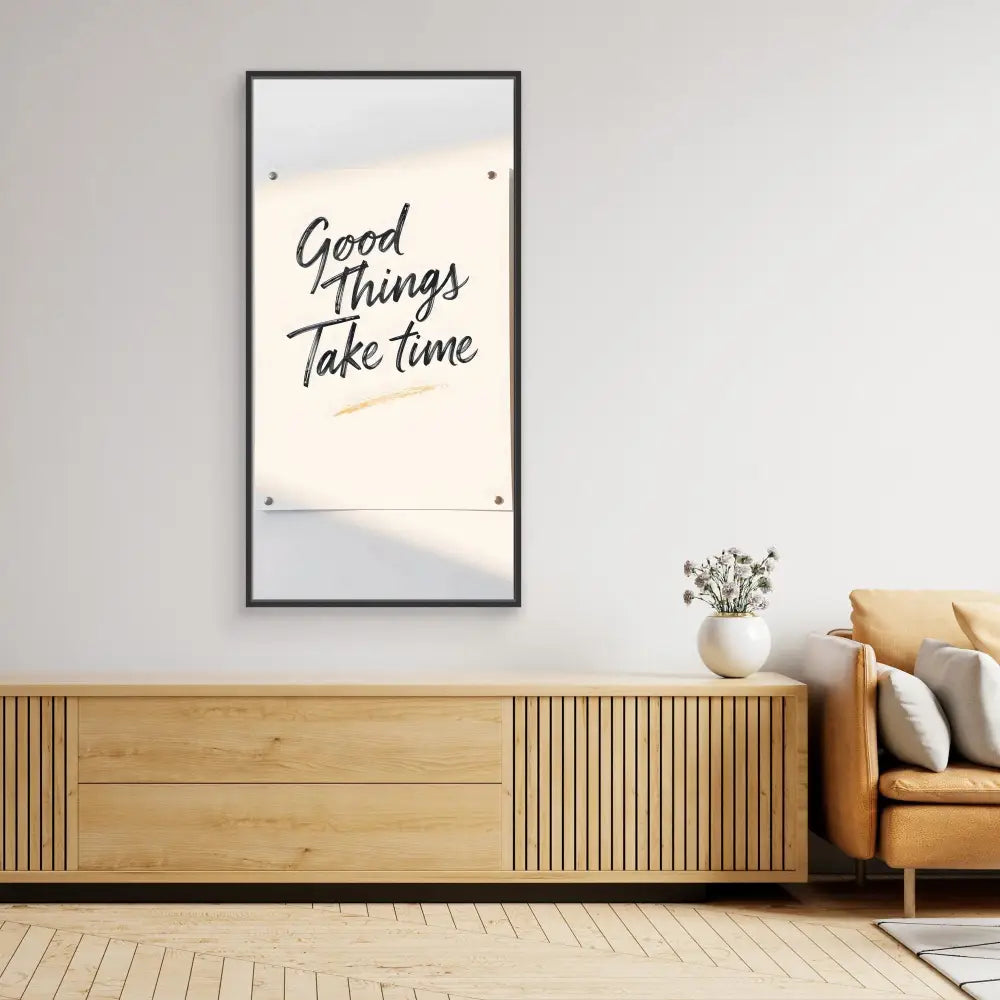 A framed motivational poster displaying ’Good Things Take Time’ in stylized text.