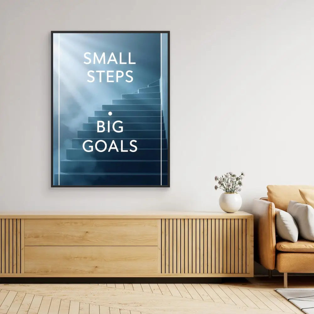 Framed motivational poster featuring the text ’SMALL STEPS BIG GOALS’ on a misty staircase background.