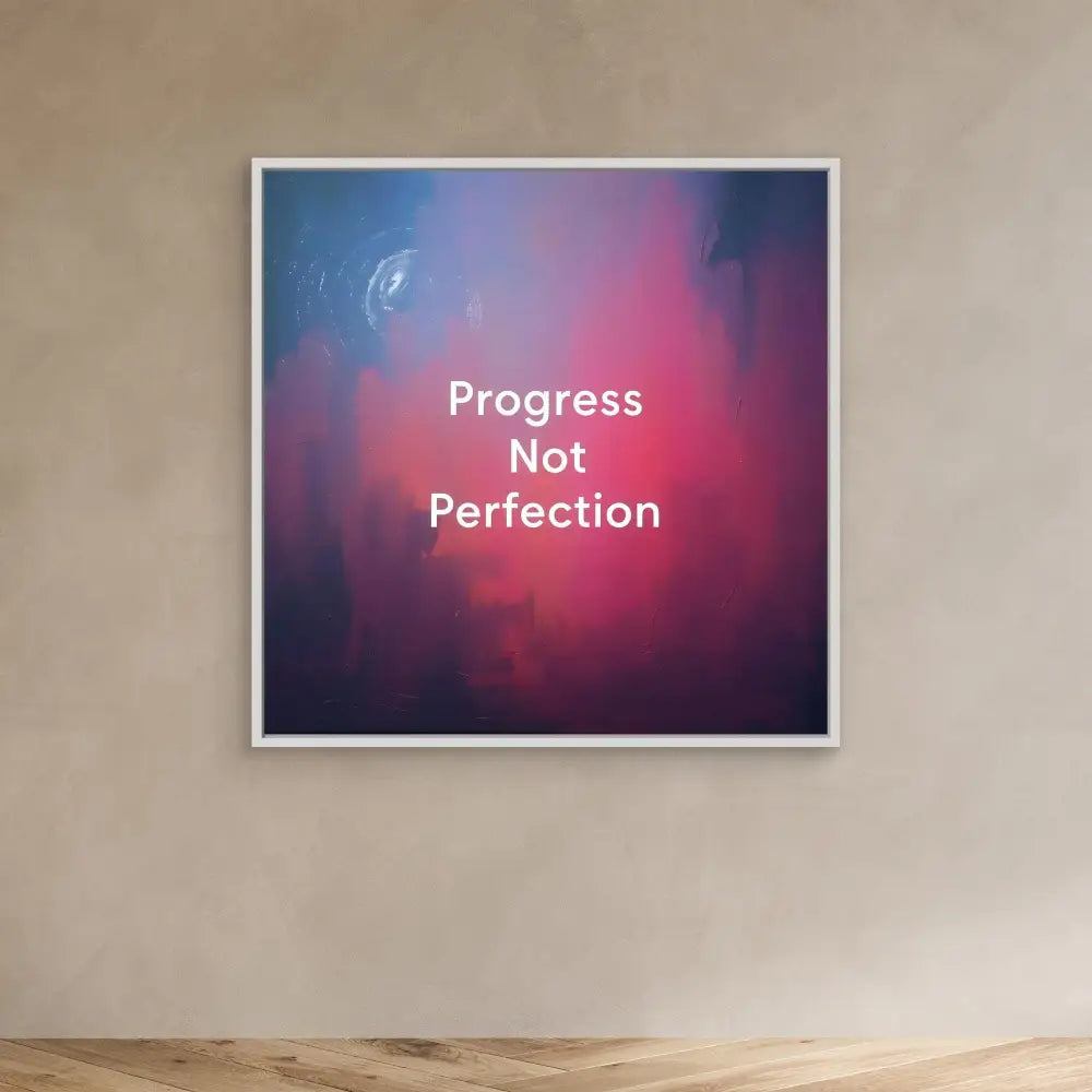 A framed motivational quote ’Progress Not Perfection’ on a pink and purple gradient background.