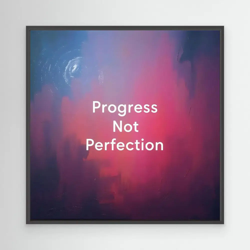 A framed motivational quote reading ’Progress Not Perfection’ on a pink and blue gradient background.