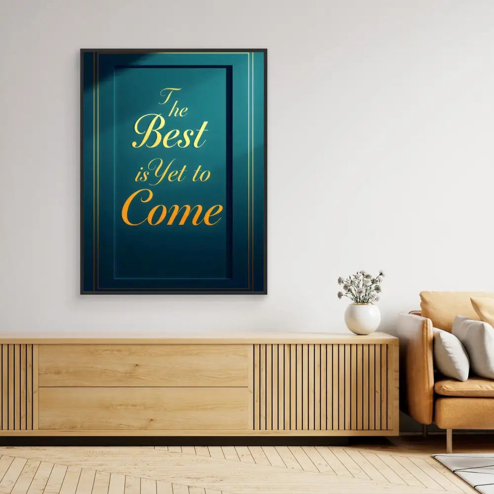 Framed motivational text art in teal and gold reading ’The Best is Yet to Come’