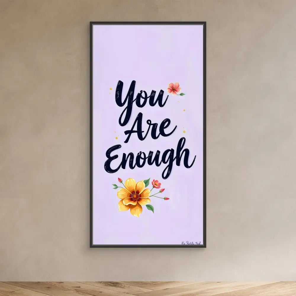 A framed motivational wall art displaying ’You Are Enough’ with floral accents.