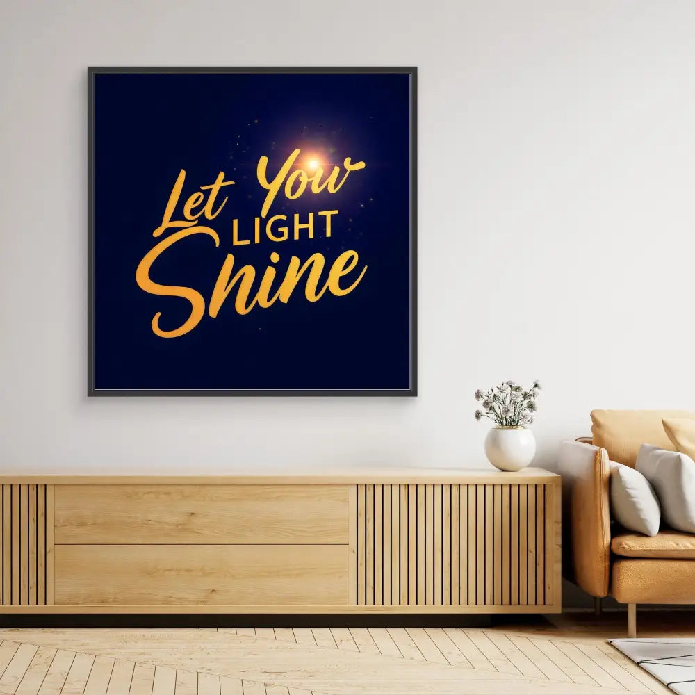 Framed motivational wall art featuring golden text ’Let Your Light Shine’ on a dark blue background.