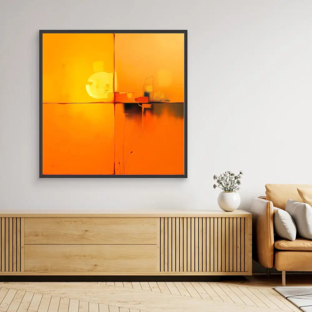 A framed orange sunset artwork featuring a boat silhouette against a glowing sun.