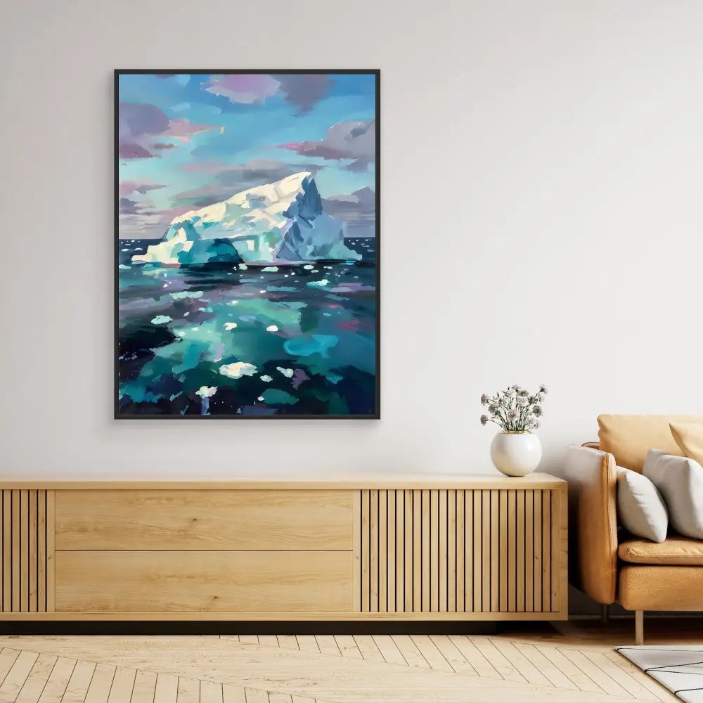 Framed painting of an iceberg floating in turquoise waters beneath a cloudy sky.