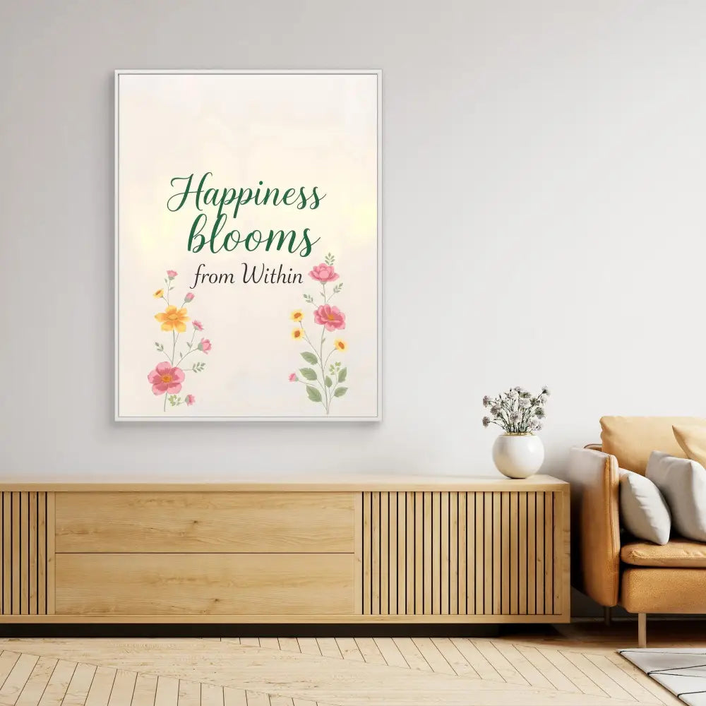 A framed wall art print featuring the text ’Happiness blooms from Within’ with watercolor flowers.