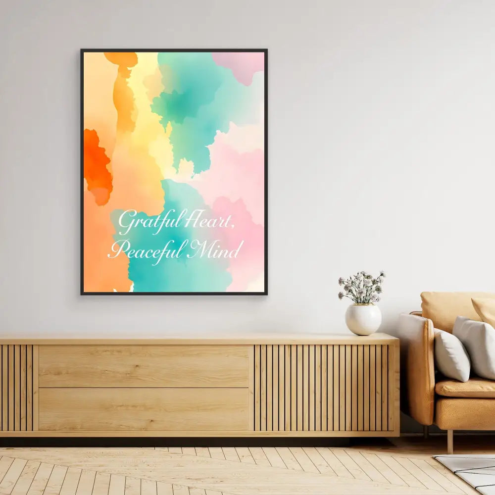 Framed watercolor art print with text ’Grateful Heart Peaceful Mind’ in pastel orange, teal and pink tones.