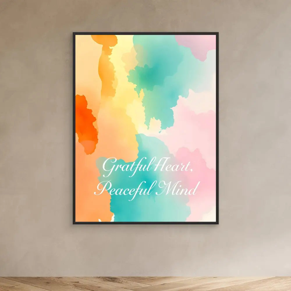 Framed watercolor artwork with text reading ’Grateful Heart, Peaceful Mind’ in soft orange, turquoise and pink tones.