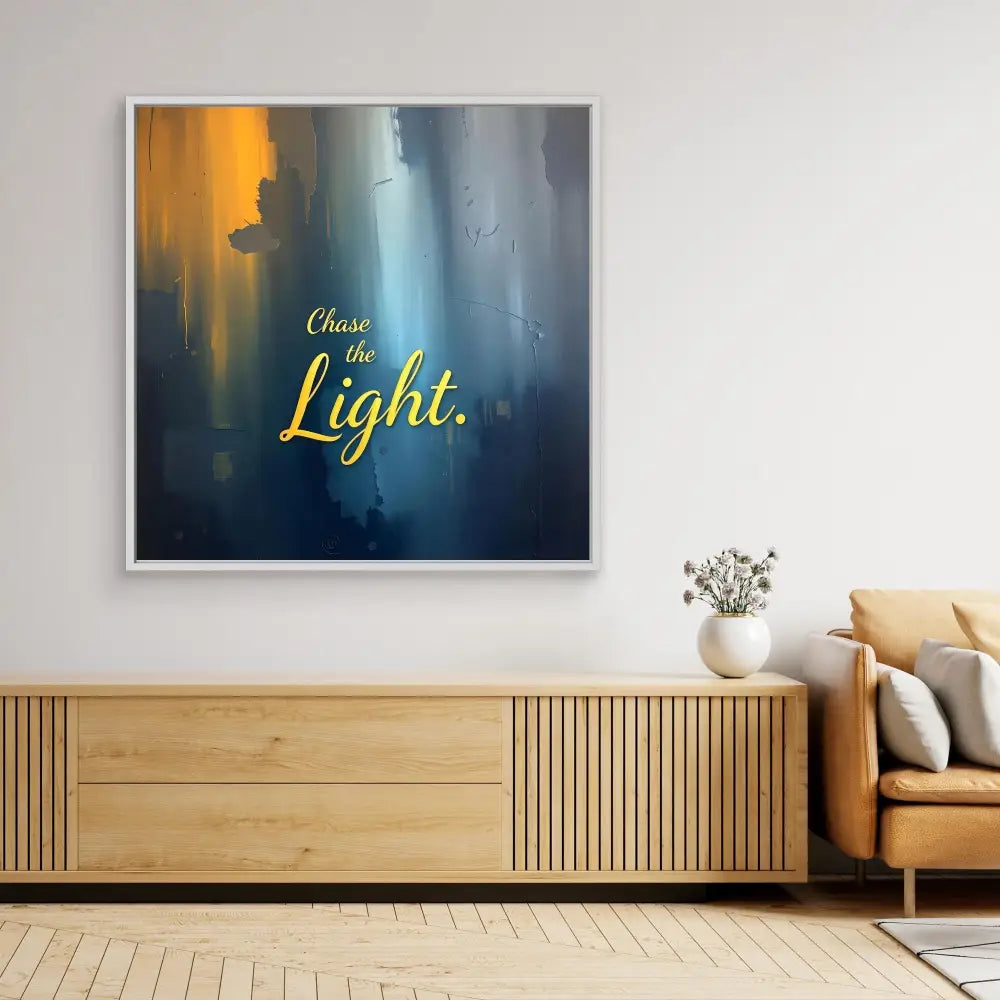 Inspirational wall art featuring yellow text ’Chase the Light’ on a blue and gold abstract background.