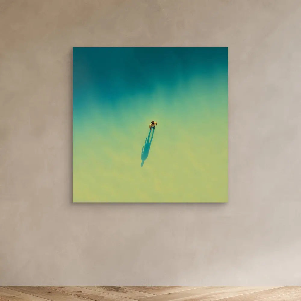 A lone surfboard rider casting a shadow on turquoise water.