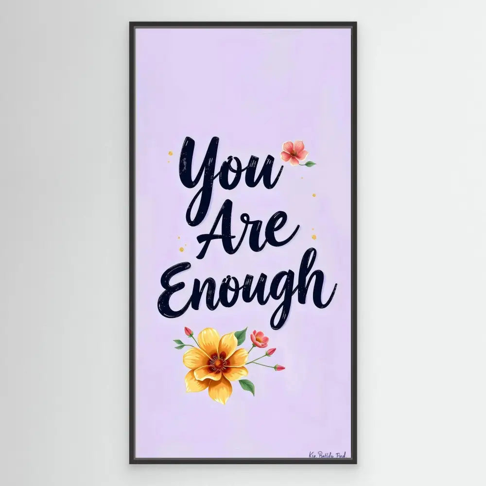 A motivational quote ’You Are Enough’ decorated with yellow and pink flowers.