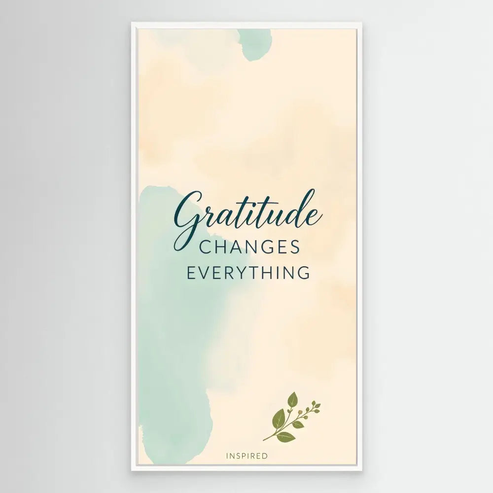 A motivational quote reading ’Gratitude changes everything’ with soft watercolor accents and a small leaf design.