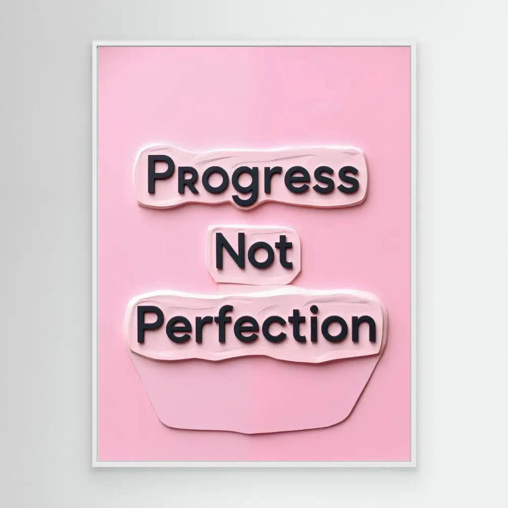 A motivational quote reading ’Progress Not Perfection’ in black text on pink paper with a torn or sticker-like effect.