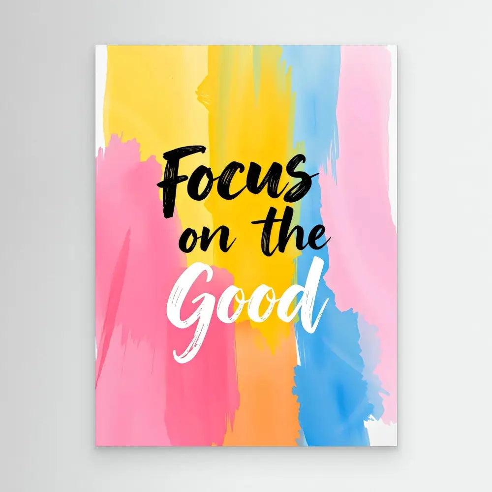 Motivational text ’Focus on the Good’ written in black and white against colorful watercolor brushstrokes.